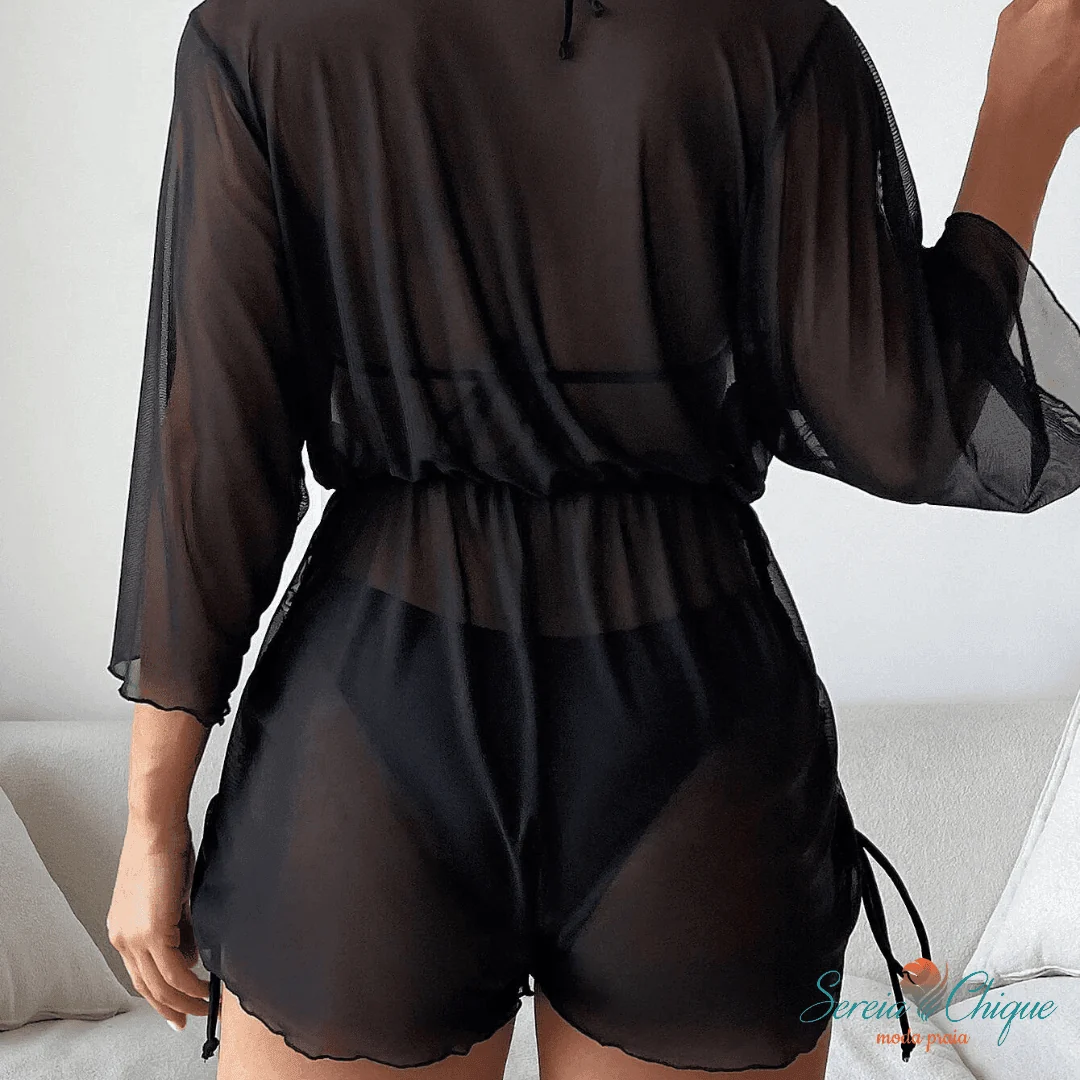 Rear view of black sheer cover-up showing gathered waist, loose sleeves and side ties